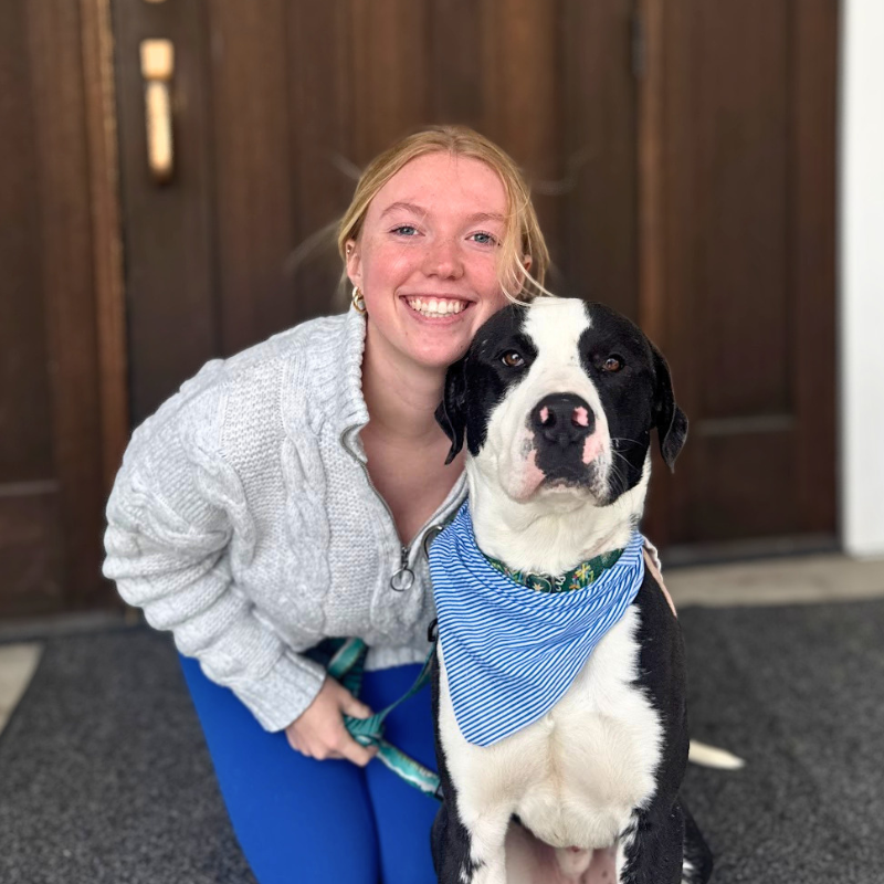 young woman posing with adoptable shelter dog