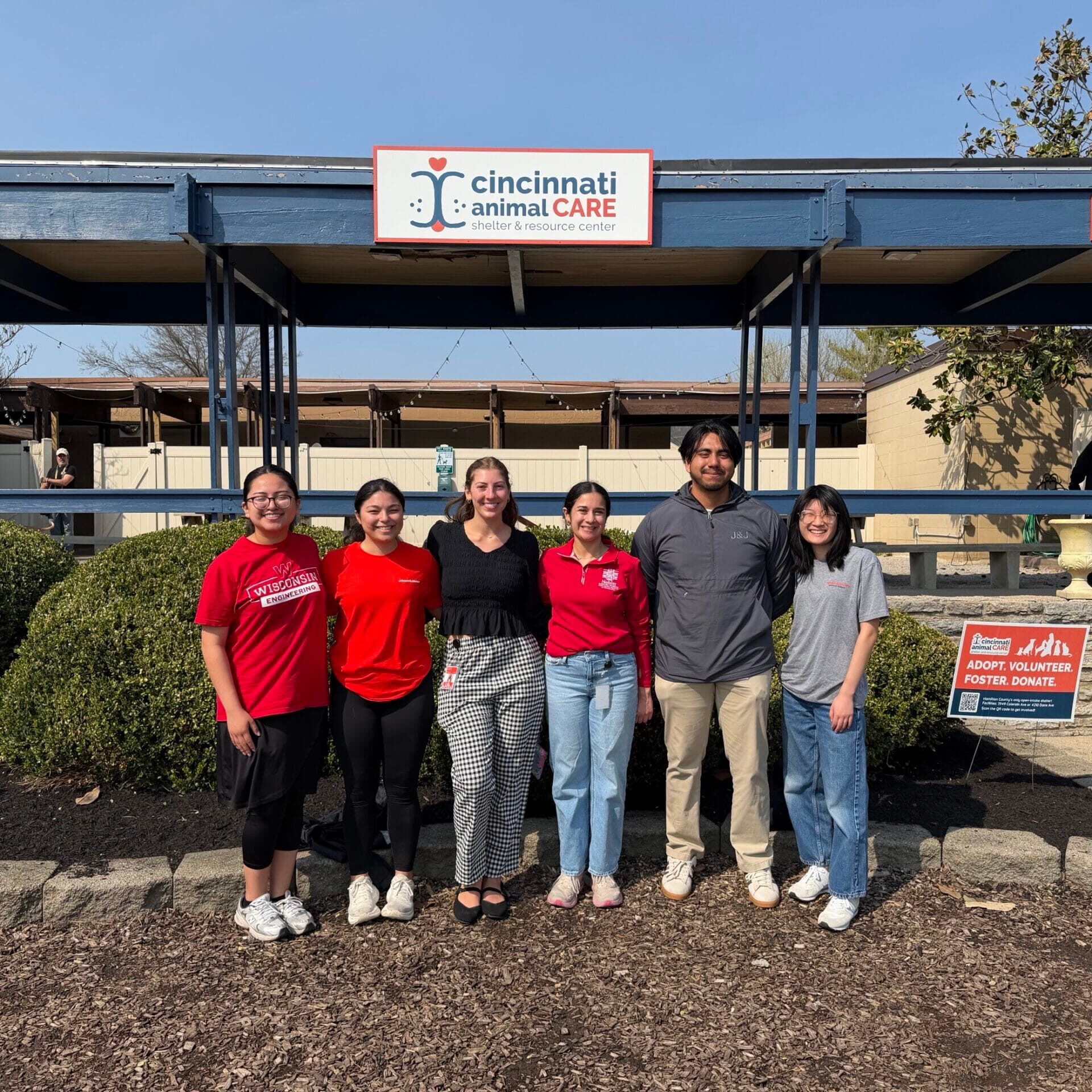 a group of six volunteers who came as a group for dog walking at cincinnati animal care